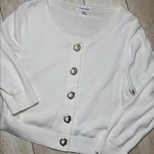 Calvin Klein Shrug with gold toggle buttons.